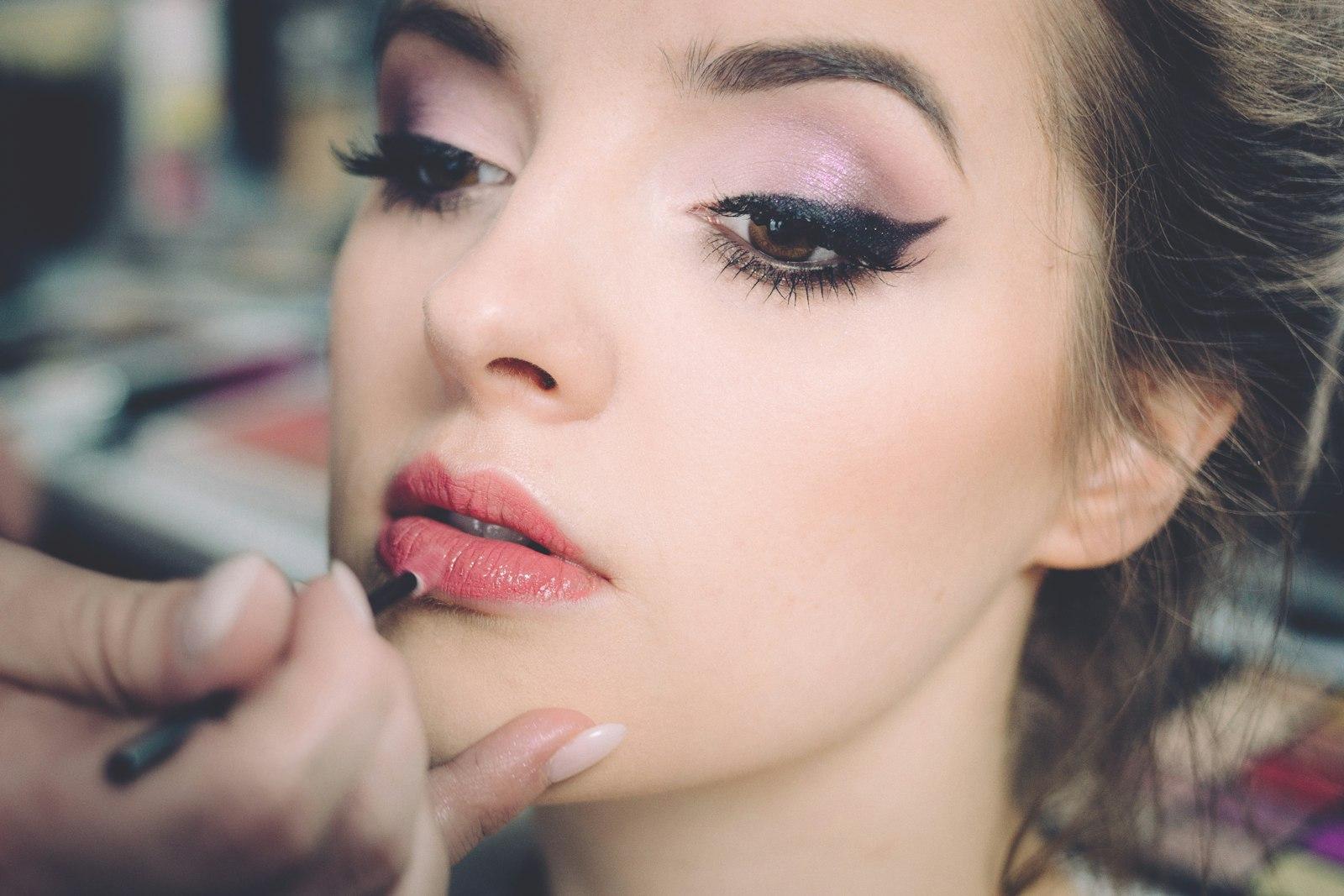 Occasion makeup being applied, with attention to the lip and eye